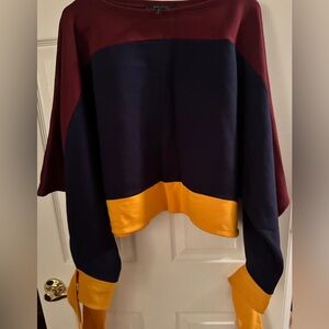 BCBG tri-color open arm bate sleeve tie at wrist